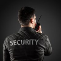 the-man-security-is-holding-walkie-talkie